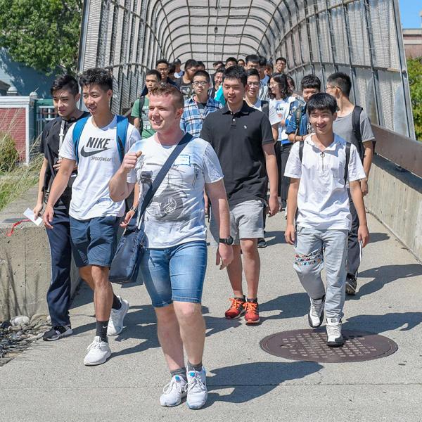 Students crossing bridge over from one side of RPI campus to the other